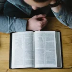 web3-man-reading-bible-book-alexander-michl-unsplash-cc0
